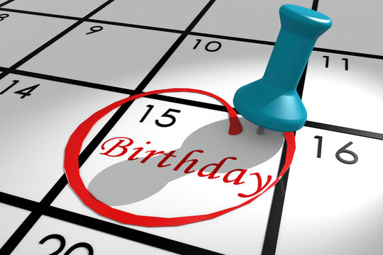 Birthday word marked on calendar with push pin
