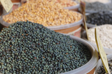 Black pepper and other spices selling on the local organic market in Istanbul, close up 