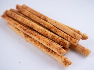 Cheese Sprinkle Stick Cookies are neatly presented and isolated against a white background.