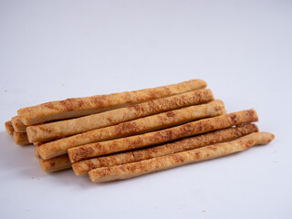 Cheese Sprinkle Stick Cookies are neatly presented and isolated against a white background.