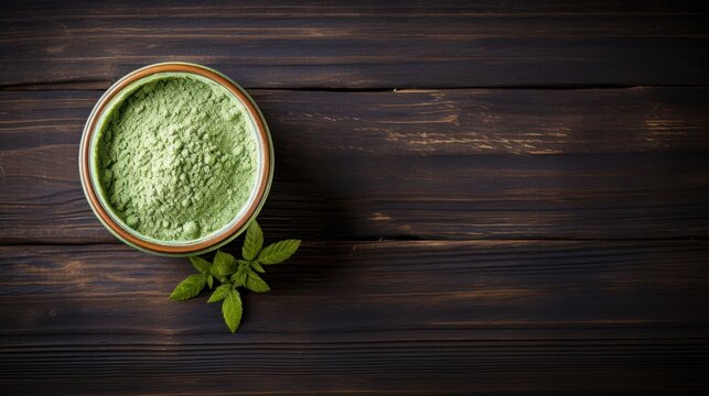 Finely powdered matcha green tea spread elegantly on a rustic wooden table