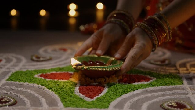 Clay diya lamps lit during diwali celebration, Diwali, or Deepavali, is India's biggest and most important holiday.
