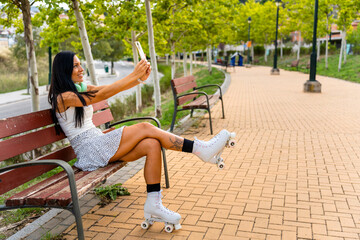 Side view of middle-aged woman wearing a dress taking a break from roller skating