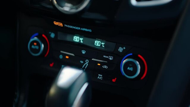 Close-up of Person Pressing an air recirculation button with a Finger. Car Interior Inside