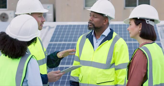 Engineering team, planning and tablet of solar panels, renewable energy or sustainable installation on rooftop. Technician, manager or people talking, outdoor group ideas or eco friendly power update