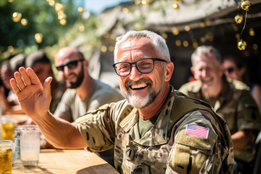 Retired happy military senior, smiling war veteran on a sunny day in a street cafe together with friends. Lifestyles, emotional celebrating Independence Day, Remembrance Day