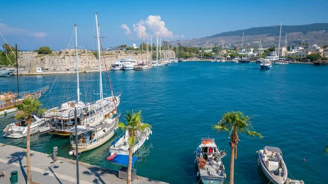 Time lapse of ships arriving in Kos Harbour viewed from elevated position, Kos Town, Kos, Dodecanese, Greek Islands