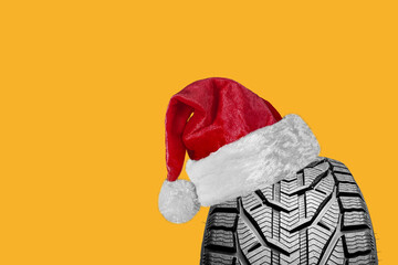 black isolation rubber tire, with a Santa Claus hat for Christmas