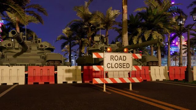 A road into and out of a city completely blocked off by military armored tanks, heavy-duty bollards, and a large 'road closed' sign.