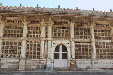 Carved stone grilles on the walls of the Tomb of Sufi Saint Shaikh Ahmed Khattu at Sarkhej Roza in Ahmedabad © RealityImages