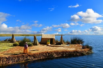 Puno and the reed islands in Lake Titicaca. Women in traditional clothing.