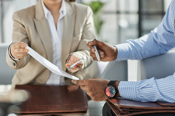 Fototapeta premium Close up of businessman or lawyers discussing about contract or business agreement at law firm office