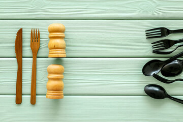 Eco friendly wooden and harmful plastic cutlery. Zero waste concept