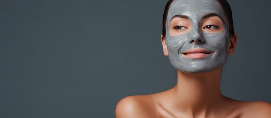 Woman getting facial treatment at salon With copyspace for text