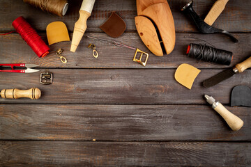 Leather workshop tools on the table. Handbag or shoe manufacturing industry