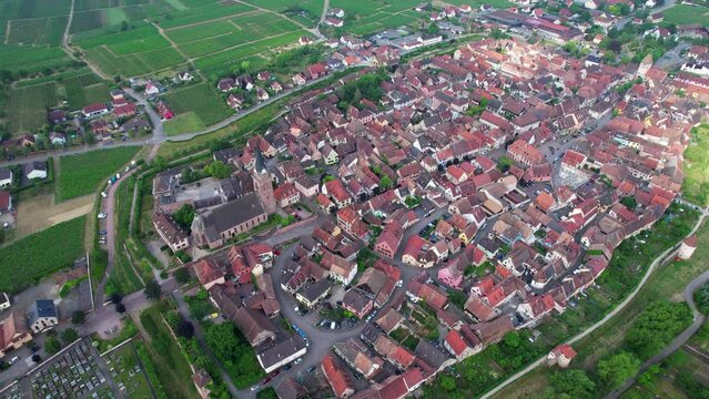 Aerial view above the beautiful French village of Bergheim and its surrounding vineyards - Alsace, France