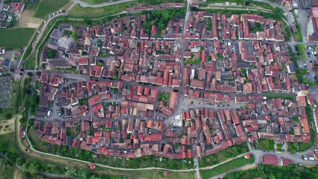 Aerial view above the beautiful French village of Bergheim and its surrounding vineyards - Alsace, France