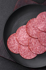 Delicious fresh smoked sausage with salt and spices cut into slices