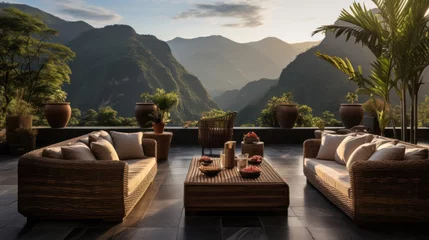 Tuinposter Decorate with rattan furniture outdoors with a mountain view © sirisakboakaew