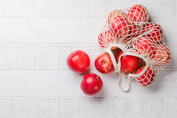 Mesh bag with fresh red apples