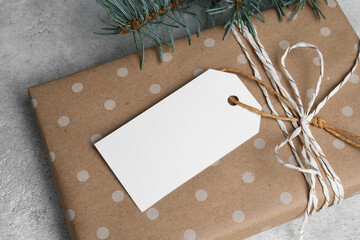 Blank white gift tag or label mockup with christmas holidays gift box