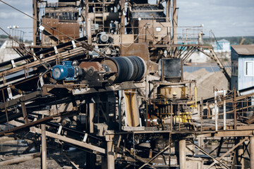Sand quarry Industrial plant with belt conveyor in open pit mining. Industry machine for stone crusher