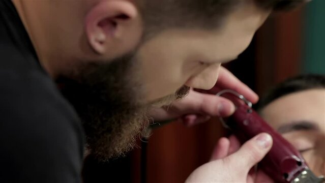 Barber shave and modeling beard at the hair salo
