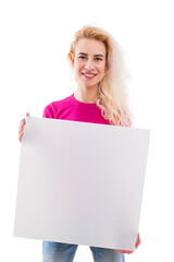 A young woman in a pink T-shirt holds a white empty board in her hands. Isolated . Copy Space.