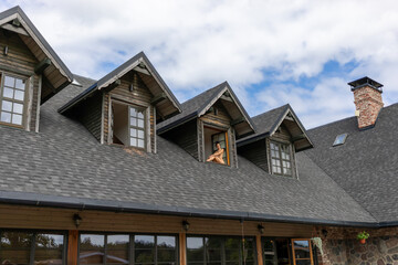 nude woman sits in the window opening of country house