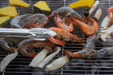Grilled shrimp, pumpkin and mushroom on the grill for party food.