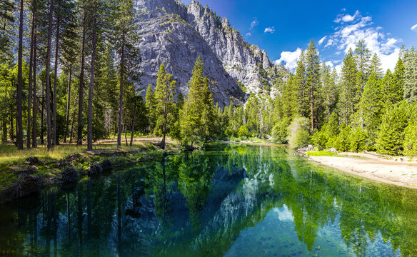 The Merced River in Yosemite National Park. Beautiful views of mountains reflecting in the river's surface. © guteksk7