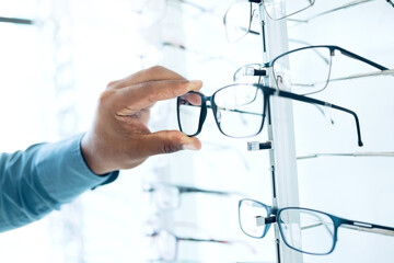 Optometry shop, eyeglasses and hands of person shopping for retail sales decision, optical clinic...