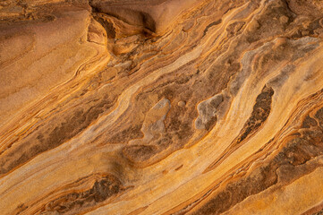 Full frame of sandstone rock pattern, Rock formation, natural of sand stone on beach in Australia, line and curve of stone use for background