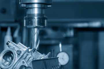 The milling process on NC milling machine with motorcycle cylinder head parts.