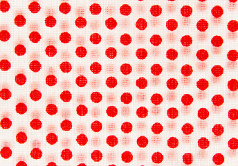 a section of fabric with red dots on white, texture with red dots on white