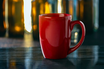 Red cup on wooden background selective focus