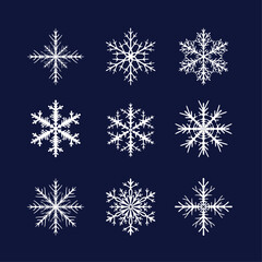 Fototapeta na wymiar Set of nine white openwork snowflakes on a blue background