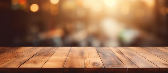 Blurry background with a chosen focus on a vacant brown table in a coffee shop