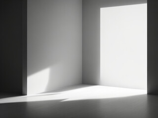 Immagine di sfondo di uno spazio vuoto in toni di grigio con un gioco di luci e ombre sulla parete e sul pavimento per lavori di progettazione o creativi