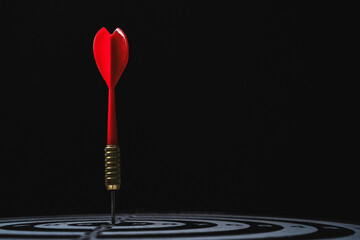 Red arrow shoot to dartboard on dark background for setup business objective target and goal...