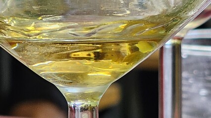 texture white wine bubbles in a glass goblet in a bar in the Langhe in Alba, in the autumn of 2023
