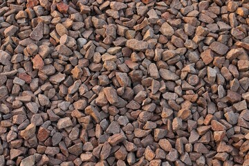 Large stones of different shapes close-up. there are a lot of small stones nearby.