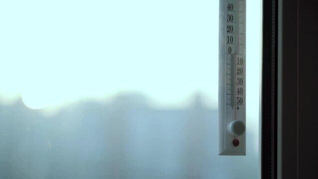 Atmospheric plastic meteorology thermometer isolated on white background.  Air temperature plus 14 degrees celsius Stock Photo