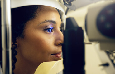 Woman, eye test and opthalmology at clinic for vision, cataract and optic health with slit lamp...