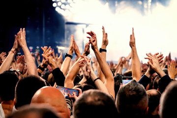 A lot of hands, crowd on concert.