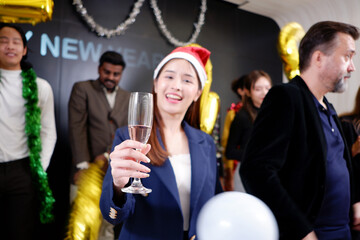 Young smiling happy teenagers celebrating Christmas, drinking champagne, Christmas party.