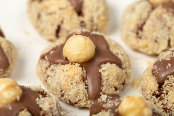 Hazelnut cookies. Chocolate and hazelnut cookies on a white wooden background. patisserie products. Close up
