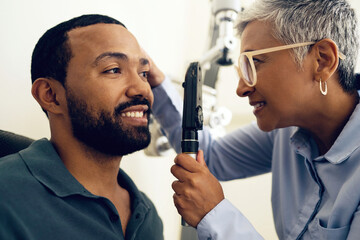Patient, eye care and medical ophthalmoscope in clinic to check retina, ocular services and...