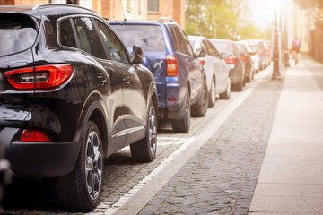 Car Parking Problem in City Street. Many Cars Parked Along Roadside. Modern Parking Problem in...