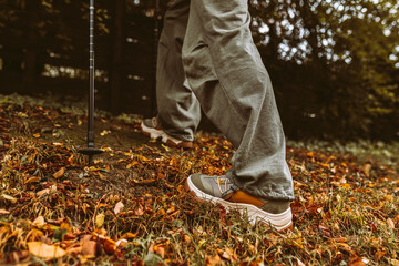Nordic Walking in Autumn forest, hiking teenage girl